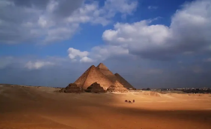 Visitors exploring the Great Pyramid of Giza and the Sphinx, one of the top things to do in Egypt during a cultural vacation.