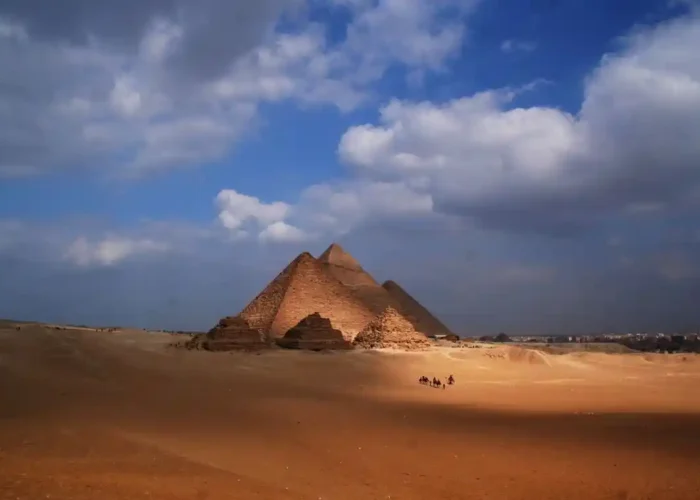 Visitors exploring the Great Pyramid of Giza and the Sphinx, one of the top things to do in Egypt during a cultural vacation.