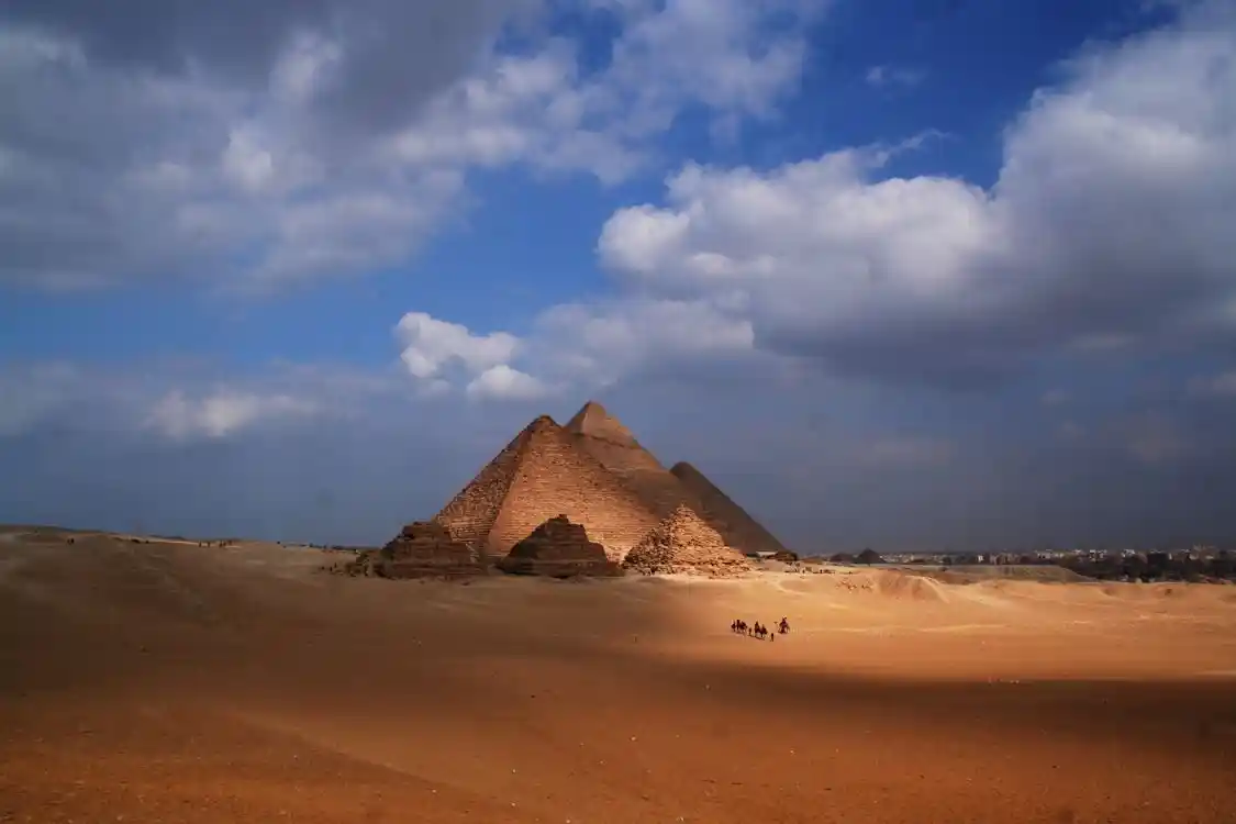 Visitors exploring the Great Pyramid of Giza and the Sphinx, one of the top things to do in Egypt during a cultural vacation.